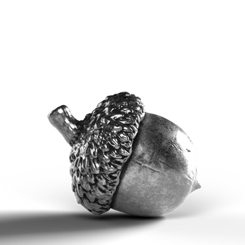 Silver acorn statue crafted from 999 fine silver.